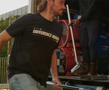 Paul Davis Restoration staff working on computers Mobile